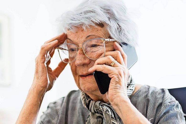 Senior Caucasian woman talking on a phone in her home