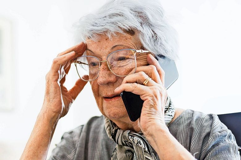 Senior Caucasian woman talking on a phone in her home